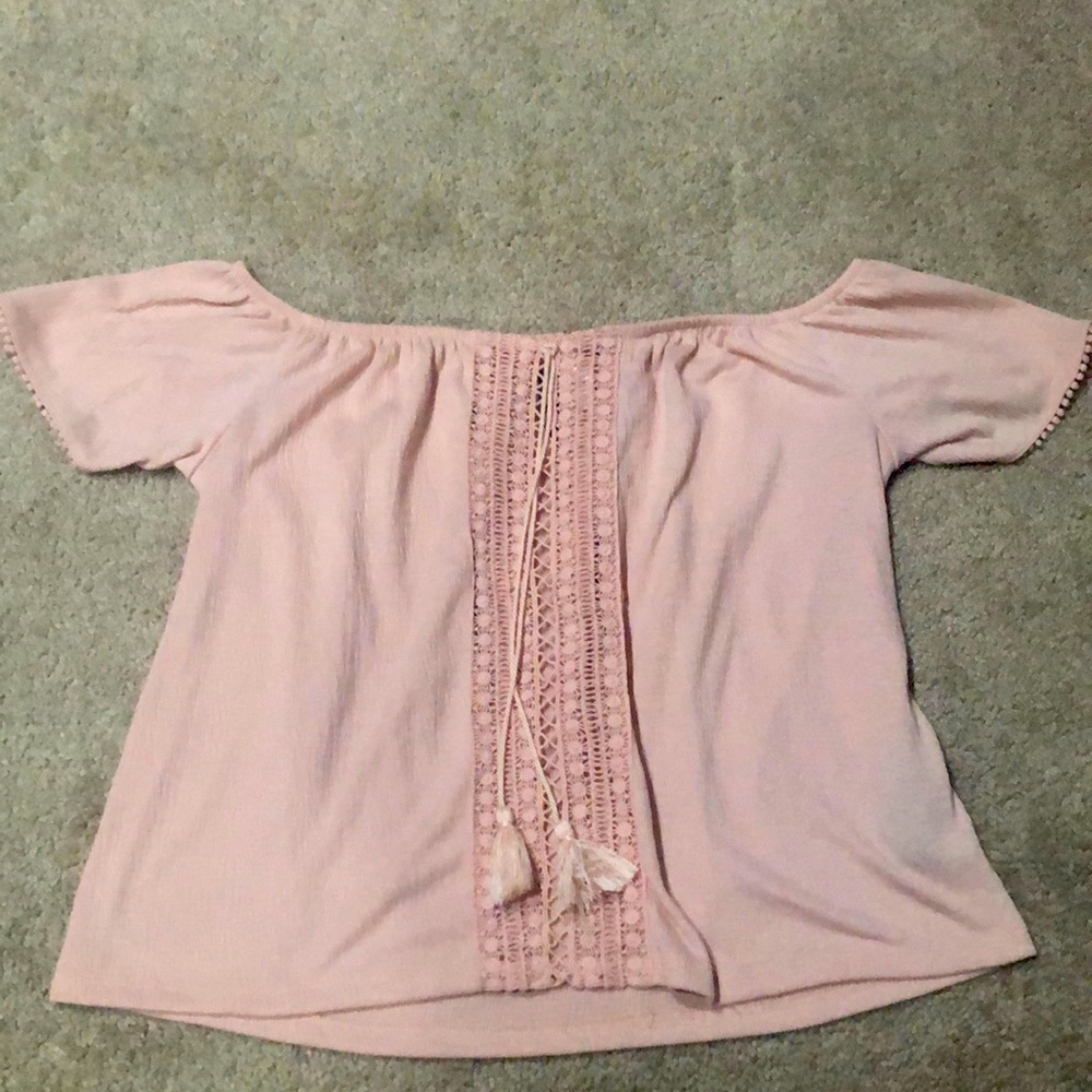 A baby pink off the shoulder top